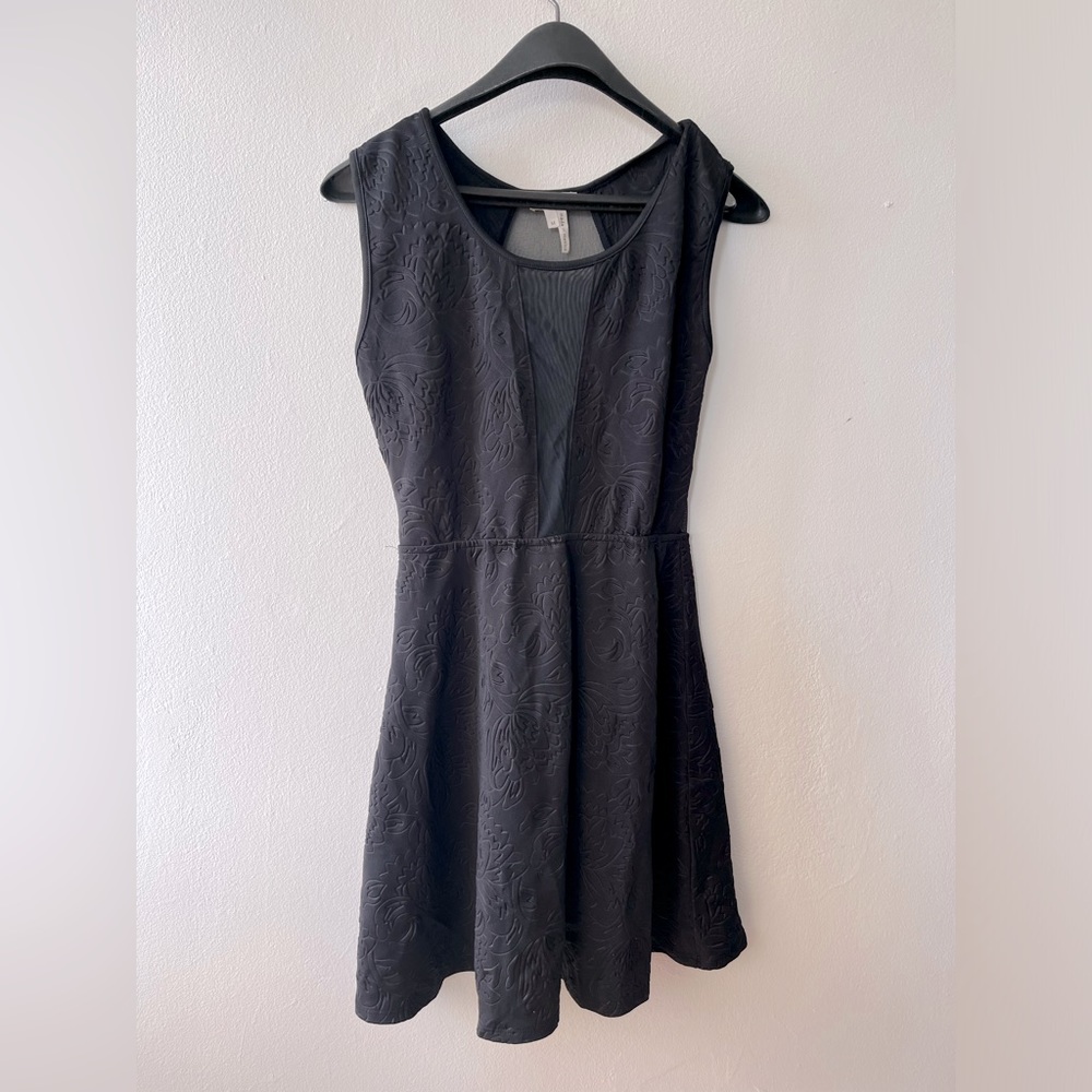 Black dress with a meshed back and cleavage